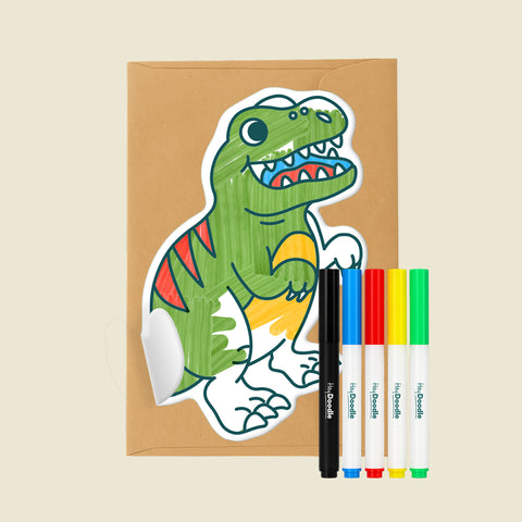 Reusable Gifting Card™ with a dinosaur illustration, an envelope and five markers on a beige background