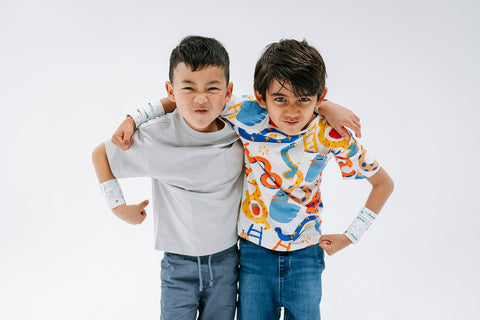 two boys wearing sketchbands