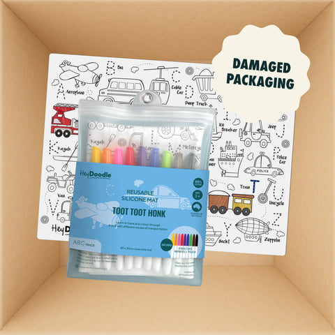 HeyDoodle Australia Classic Mats reusable silicone activity mat featuring black-and-white vehicle drawings and a pouch of colorful markers, shown inside a box with packaging defects.