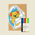 Reusable Gifting Card™ with a cartoon koala design, an envelope and five markers on a beige background
