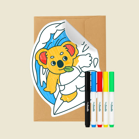 Reusable Gifting Card™ with a cartoon koala design, an envelope and five markers on a beige background