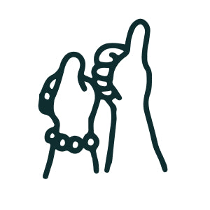 Outline of two hands giving a thumbs-up on a silicone mat—one wearing a dotted bracelet—ready for kids to colour and reuse.