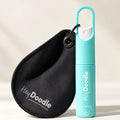 A small, turquoise HeyDoodle Spray & Wipe bottle featuring a bear icon, paired with a black teardrop-shaped pouch, both attached to a carabiner for convenient cleaning of silicone mats during colouring sessions.