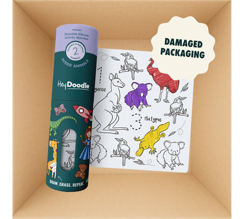 A cylindrical silicone container featuring animal and space illustrations next to a HeyDoodle Australia Mini Mats (Damaged packaging) reusable silicone activity mat decorated with outline drawings of Australian animals, some partially filled with colour.