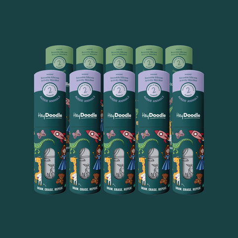 Ten HeyDoodle Mini Reusable Silicone Colouring & Doodle Mats from the Party Saver pack are arranged in their cylindrical packaging, each mat displaying vivid illustrations of animals, rockets, and children set against a dark green background. Designed for repeated use and easy cleaning, these colourful silicone mats provide creative fun and make ideal party gifts for kids who love to colour.