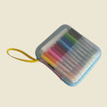 The HeyDoodle Australia Travel Case is a blue silicone zippered case with a yellow strap and twelve colorful markers inside.